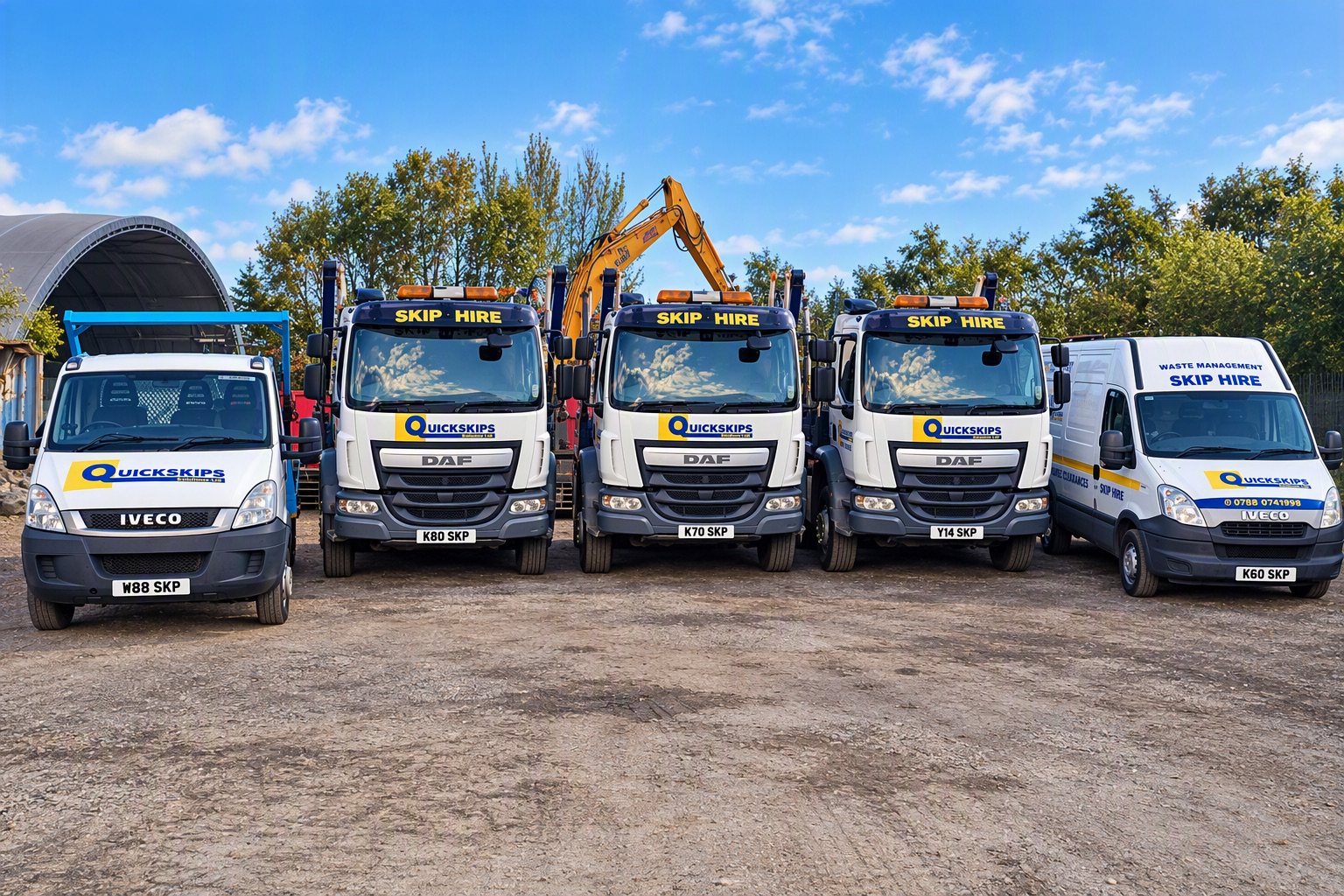 Quick Skips Falkirk skip lorries and vans lined up at the Bonnybridge yard