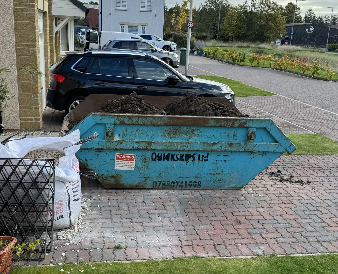 Quick Skips skip on a customer driveway